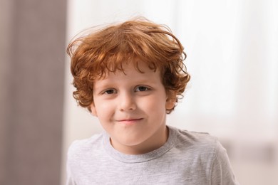 Photo of Portrait of little boy indoors, closeup. Cute child
