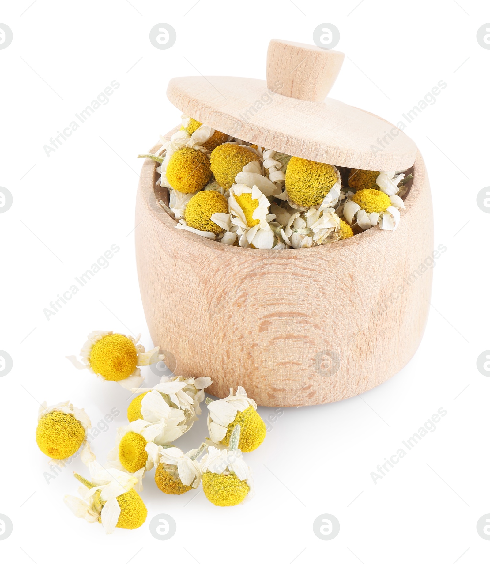 Photo of Chamomile flowers in wooden bowl isolated on white