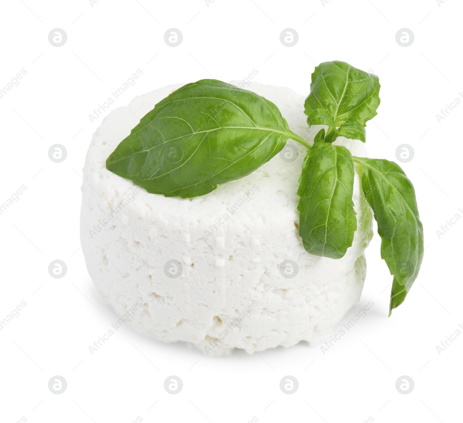 Photo of Fresh ricotta (cream cheese) and basil isolated on white