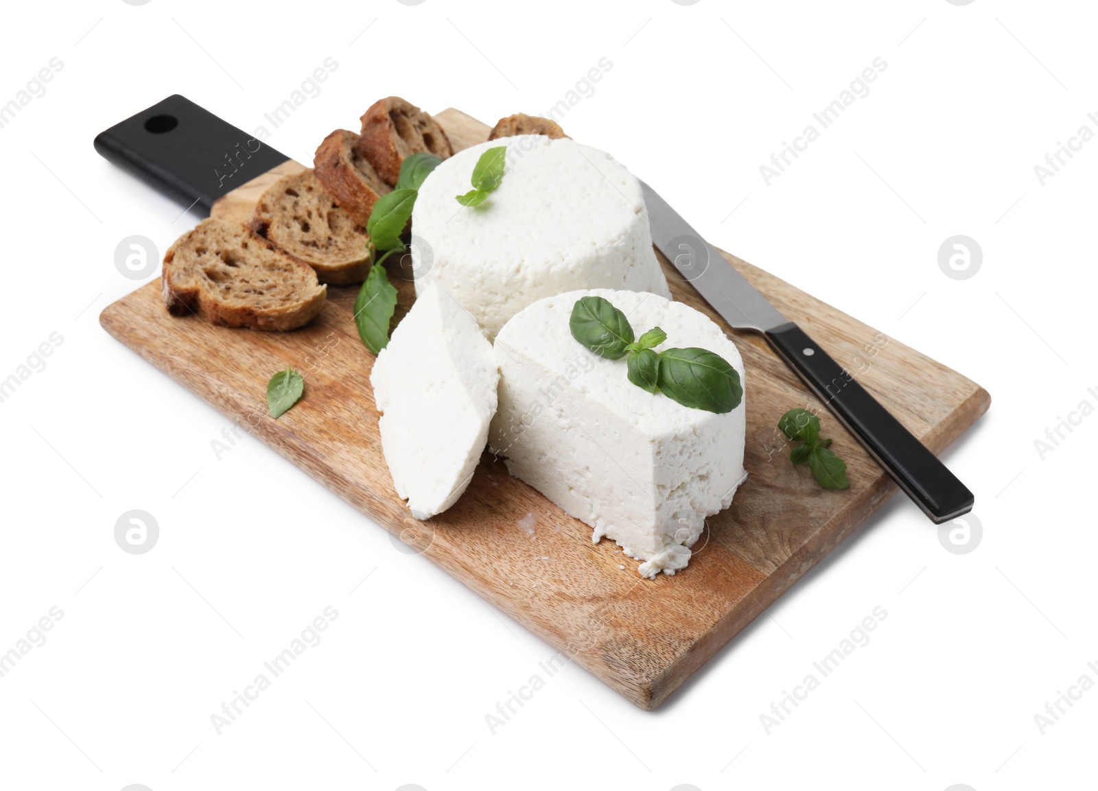 Photo of Fresh ricotta (cream cheese), basil, bread and knife isolated on white