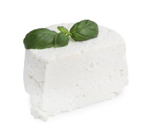 Photo of Fresh ricotta (cream cheese) and basil isolated on white