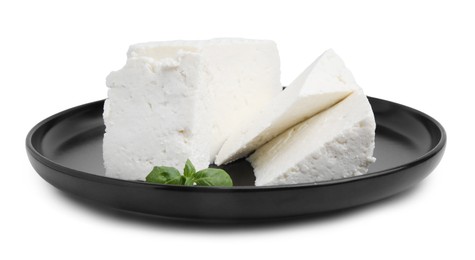 Fresh ricotta (cream cheese) and basil isolated on white