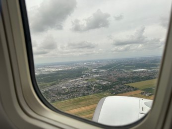 Photo of Picturesque view through plane window during flight