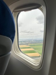 Photo of Picturesque view through plane window during flight