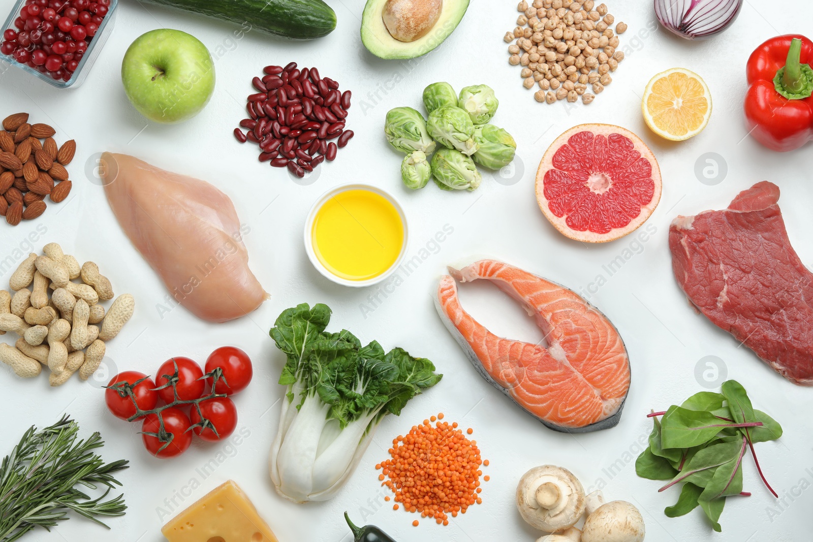 Photo of Flat lay composition with fresh meat and other products for balanced diet on white background