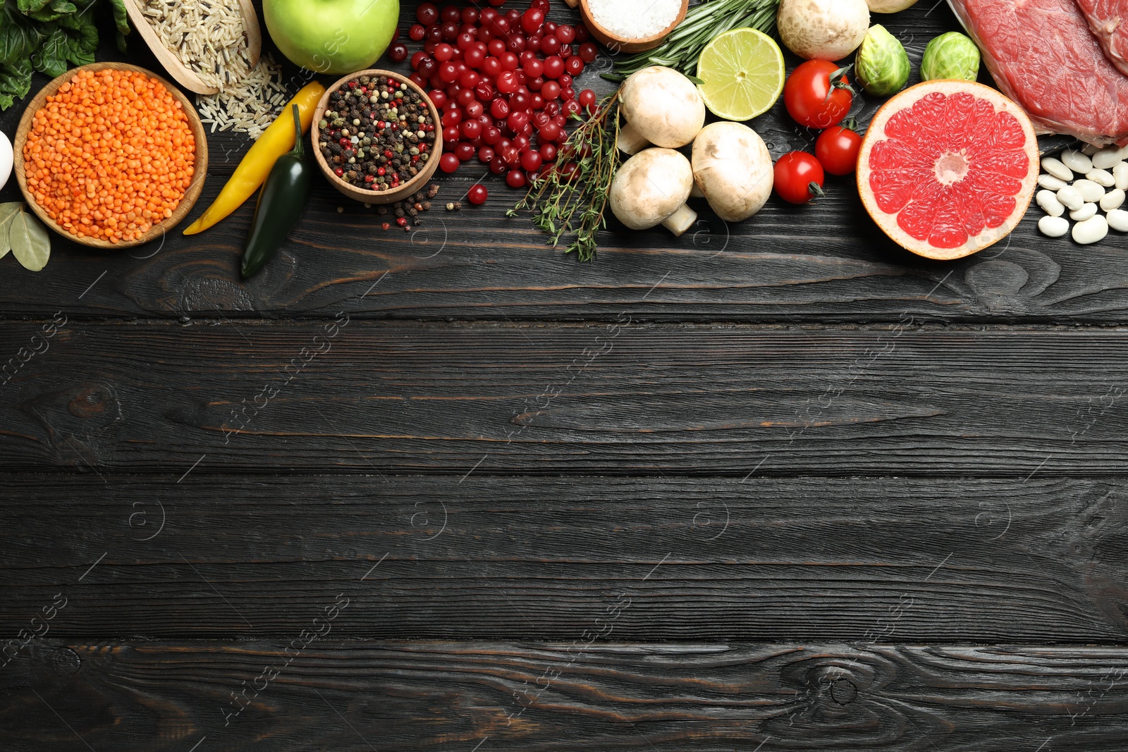 Photo of Flat lay composition with fresh meat and other products on wooden table, space for text. Balanced diet