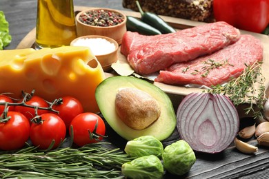 Fresh meat and other products for balanced diet on table