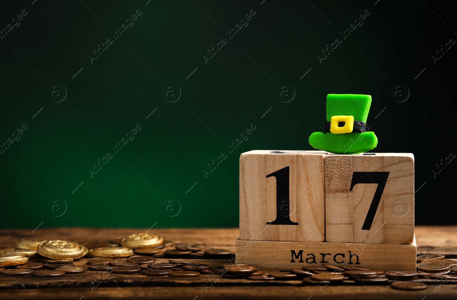 Photo of Composition with block calendar on wooden table, space for text. St. Patrick's Day celebration