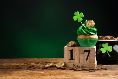 Photo of Composition with block calendar on wooden table, space for text. St. Patrick's Day celebration