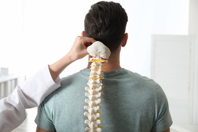 Photo of Man visiting professional orthopedist in medical office