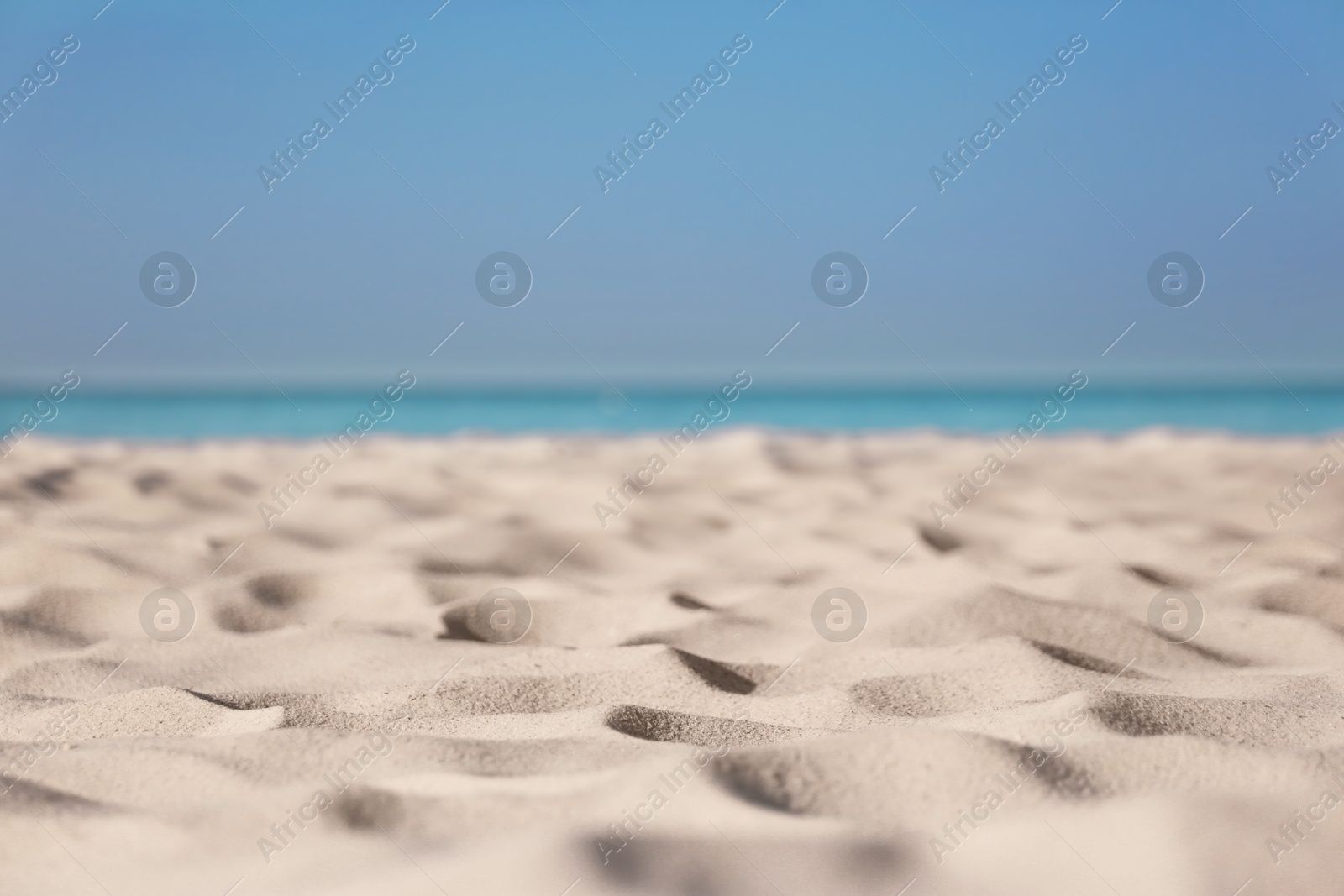 Photo of Beautiful sandy beach and sea on sunny day. Summer vacation