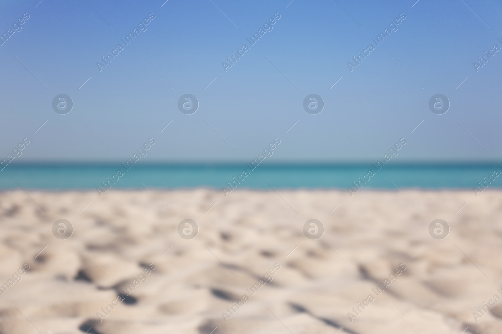 Photo of Beautiful sandy beach and sea on sunny day. Summer vacation