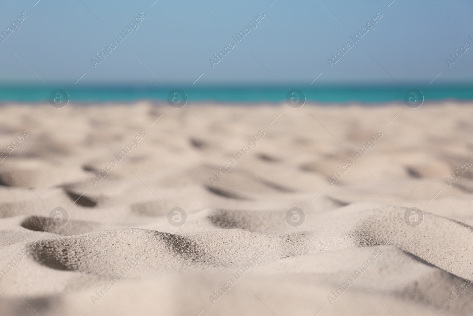 Photo of Beautiful sandy beach and sea on sunny day. Summer vacation