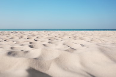 Photo of Beautiful sandy beach and sea on sunny day. Summer vacation