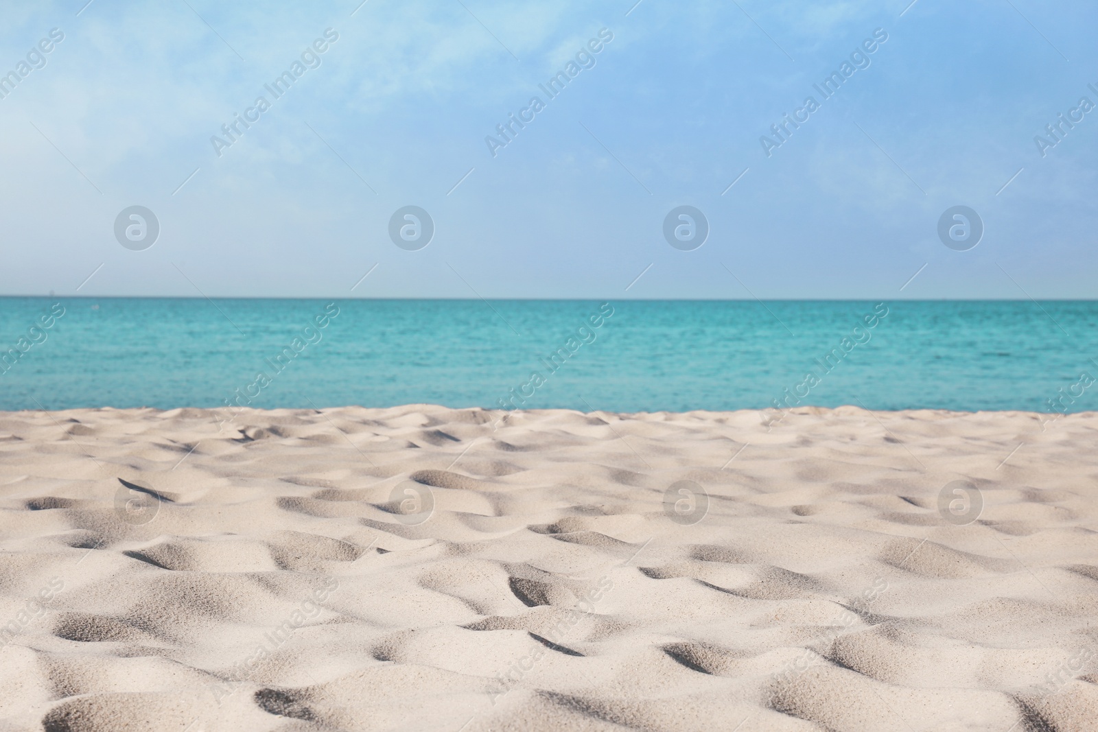 Photo of Beautiful sandy beach and sea on sunny day. Summer vacation