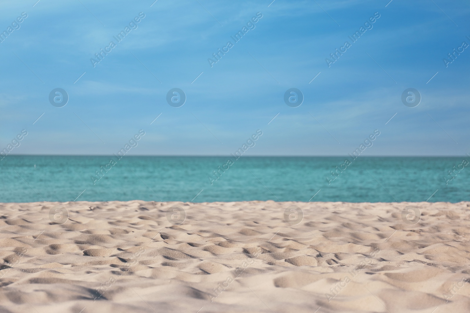 Photo of Beautiful sandy beach and sea on sunny day. Summer vacation