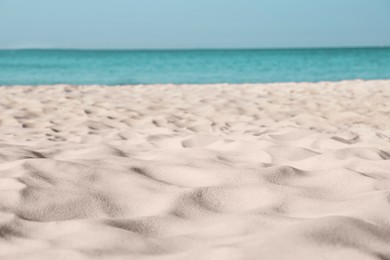 Photo of Beautiful sandy beach and sea on sunny day. Summer vacation