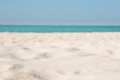 Photo of Beautiful sandy beach and sea on sunny day. Summer vacation