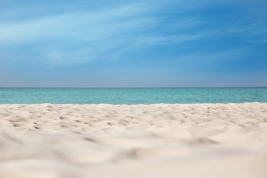 Photo of Beautiful sandy beach and sea on sunny day. Summer vacation