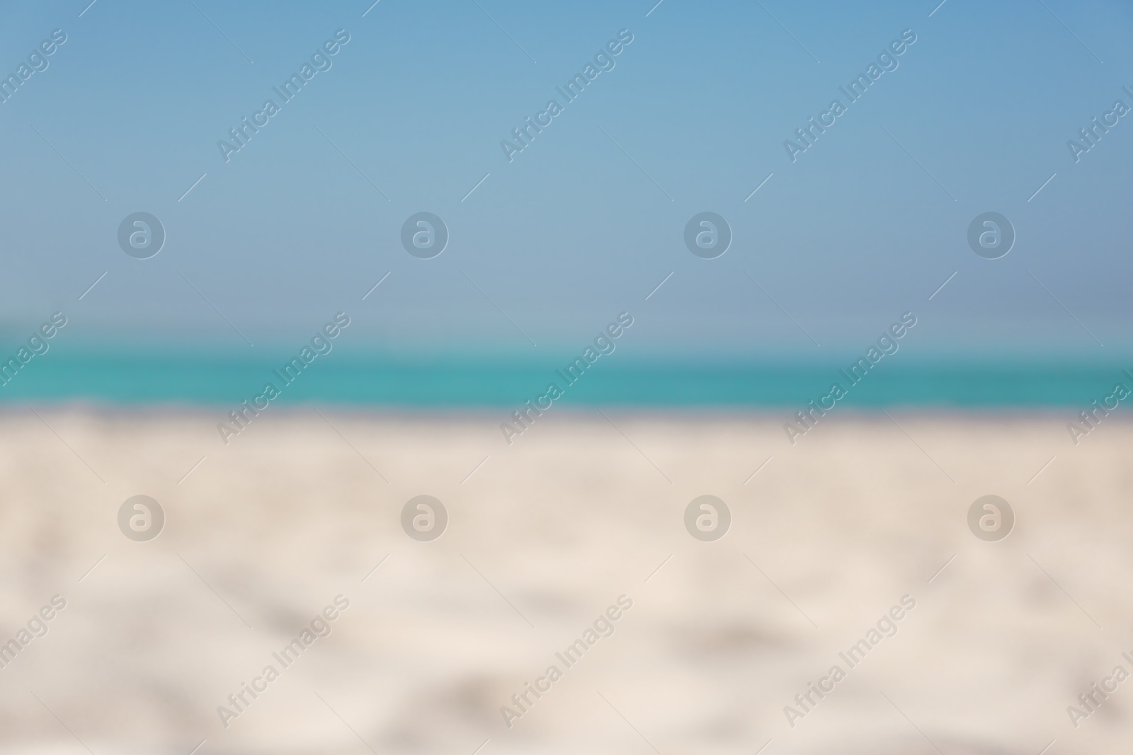 Photo of Blurred view of beautiful sandy beach and sea on sunny day. Summer vacation