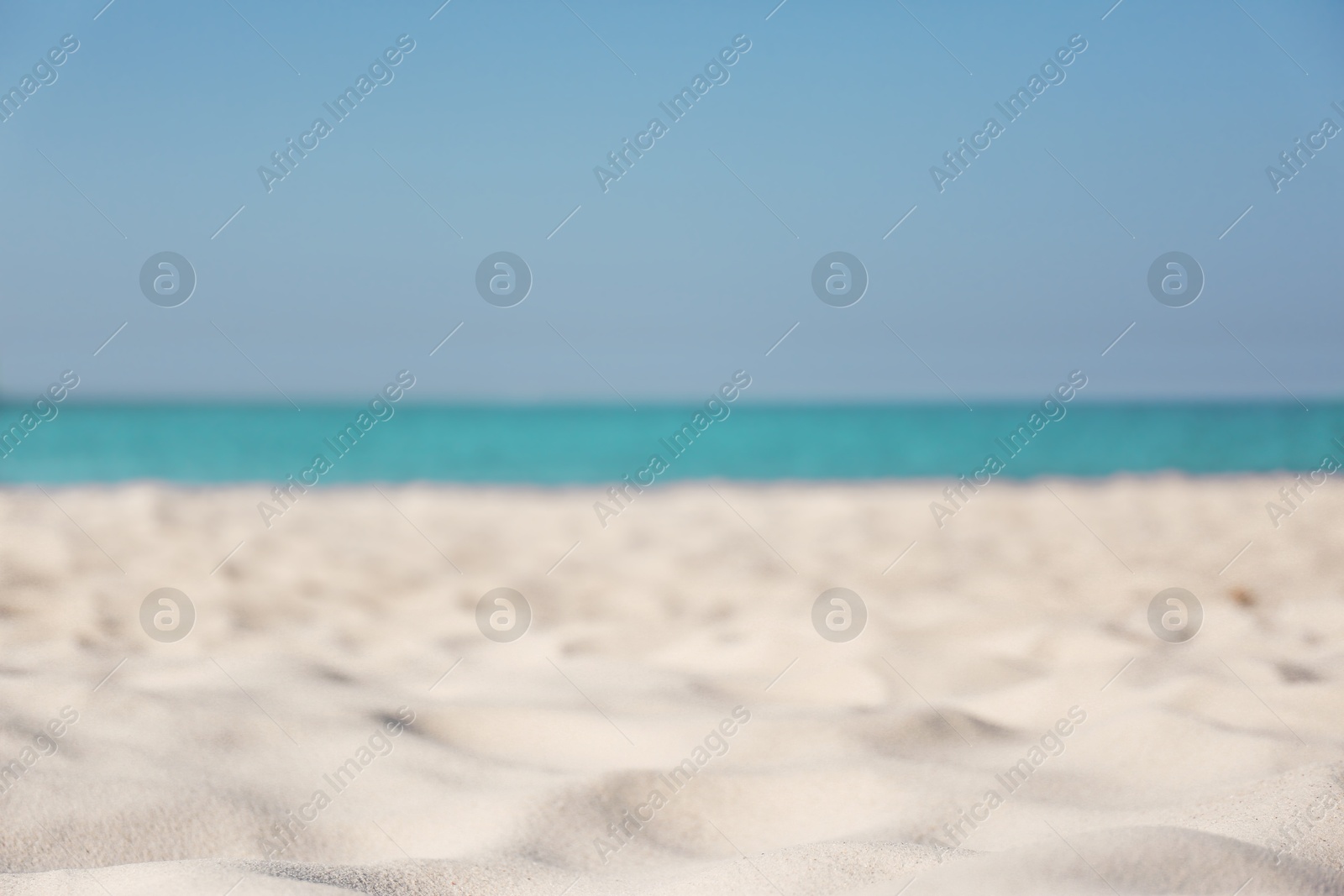 Photo of Beautiful sandy beach and sea on sunny day. Summer vacation