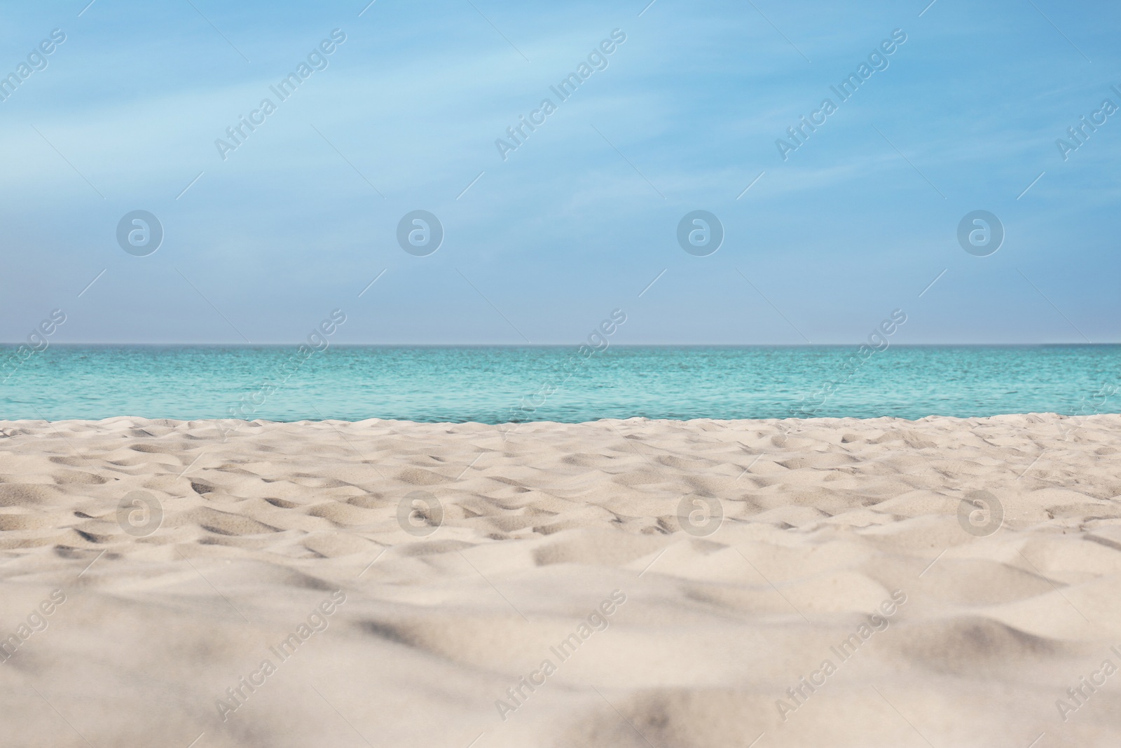 Photo of Beautiful sandy beach and sea on sunny day. Summer vacation