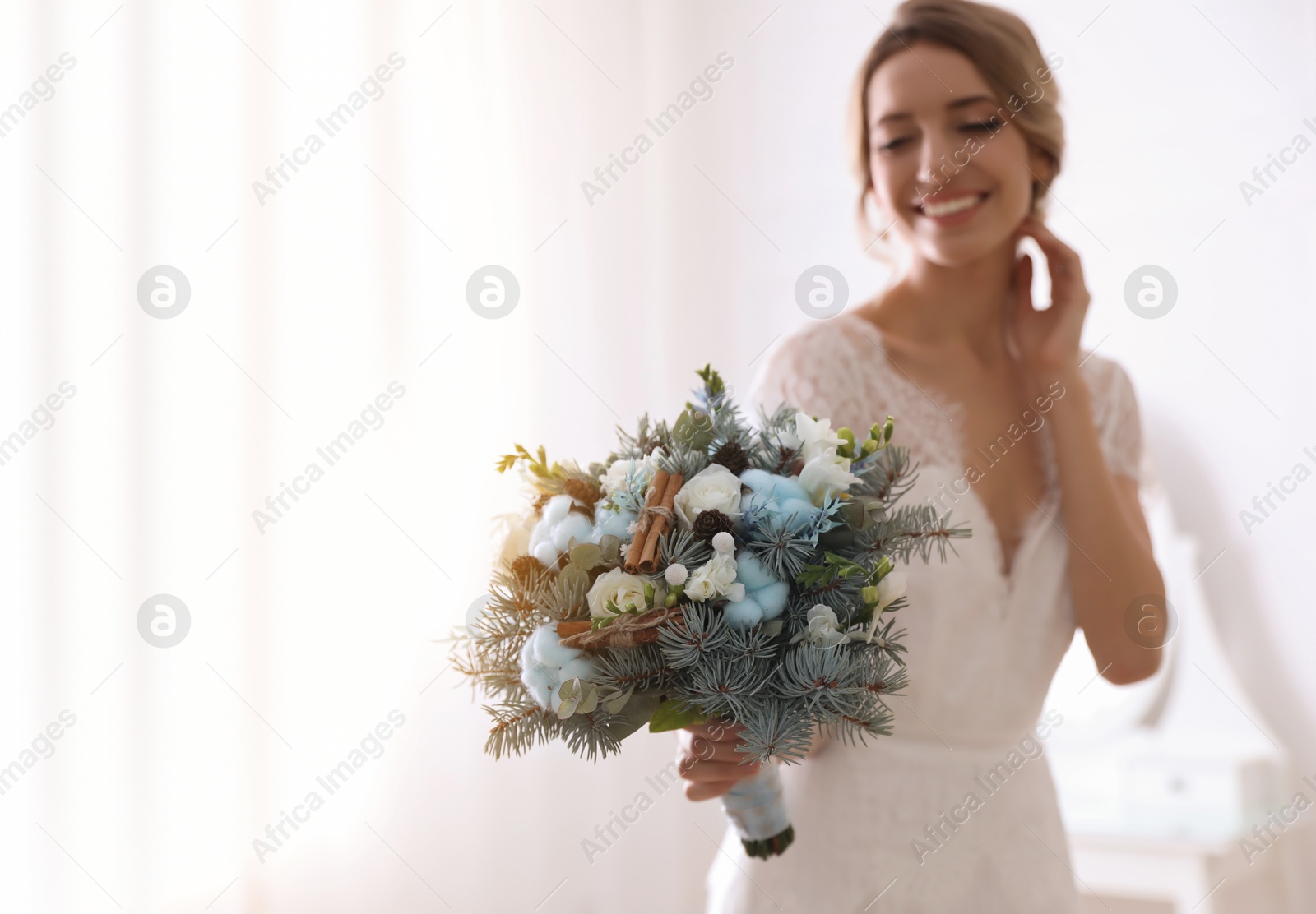 Photo of Beautiful bride with winter wedding bouquet indoors. Space for text