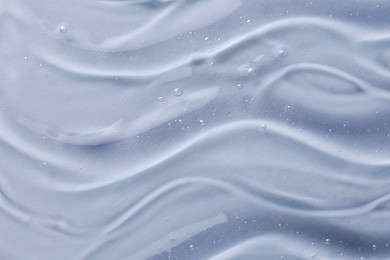 Texture of transparent shower gel on white background, closeup