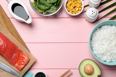 Photo of Frame of different ingredients on pink wooden table, flat lay. Space for text