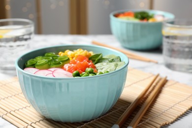 Delicious salad with salmon and vegetables served on table