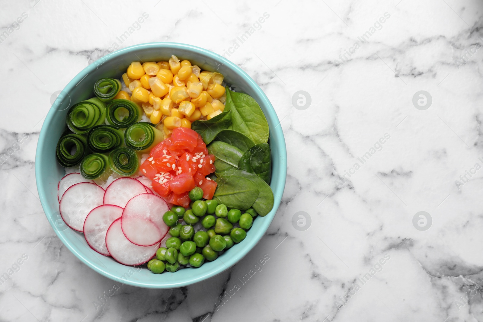 Photo of Delicious salad with salmon and vegetables on white marble table, top view. Space for text