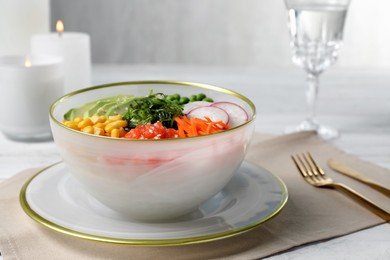 Photo of Delicious salad with salmon and vegetables served on grey table