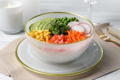 Photo of Delicious salad with salmon and vegetables served on grey table