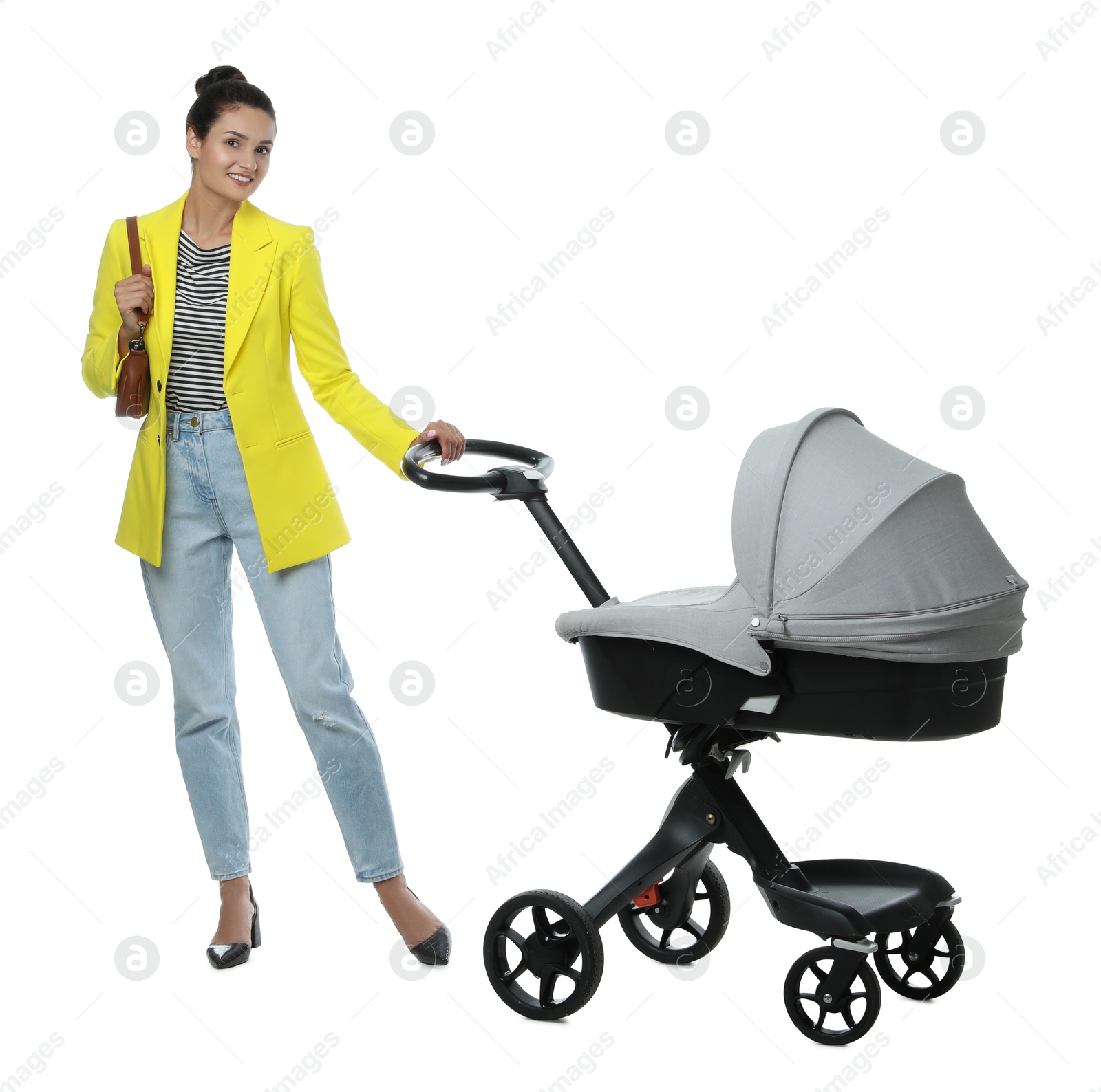 Photo of Happy young woman with baby stroller on white background