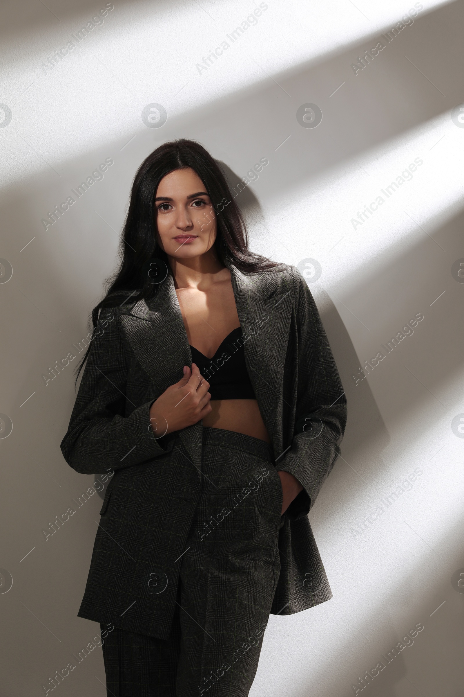 Photo of Beautiful woman in formal suit on white background. Business attire