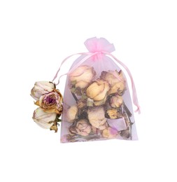 Photo of Scented sachet and dried rose flowers on white background, top view