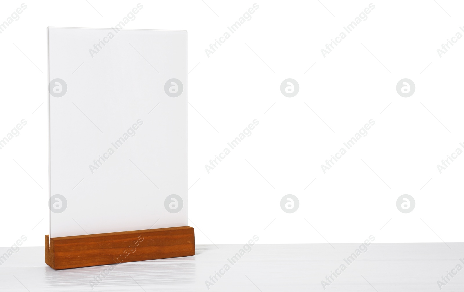 Photo of Menu holder on light wooden table against white background. Space for text