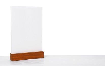 Photo of Menu holder on light wooden table against white background. Space for text