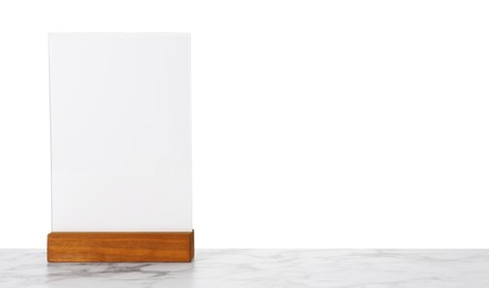 Photo of Menu holder on light marble table against white background. Space for text