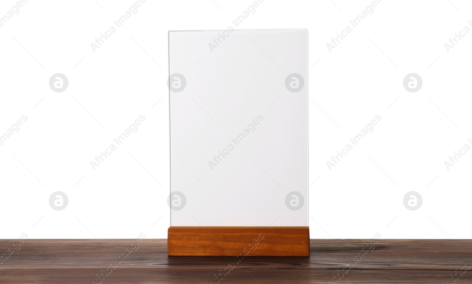 Photo of Menu holder on wooden table against white background. Mockup for design