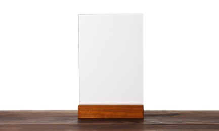 Photo of Menu holder on wooden table against white background. Mockup for design