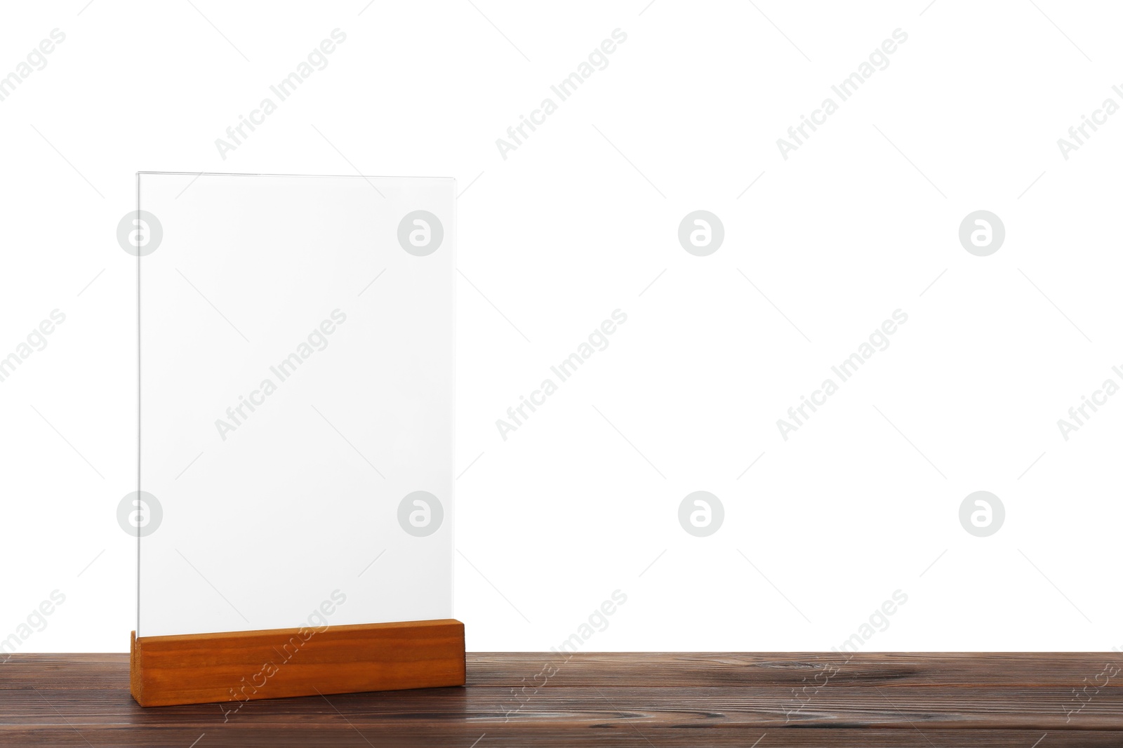 Photo of Menu holder on wooden table against white background. Mockup for design