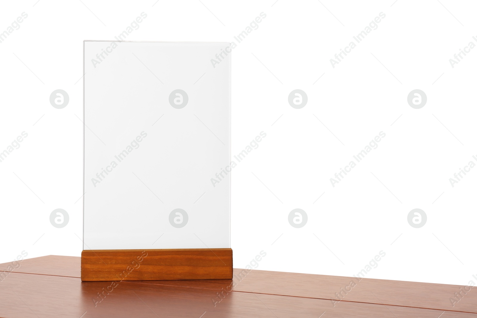 Photo of Menu holder on wooden table against white background. Mockup for design