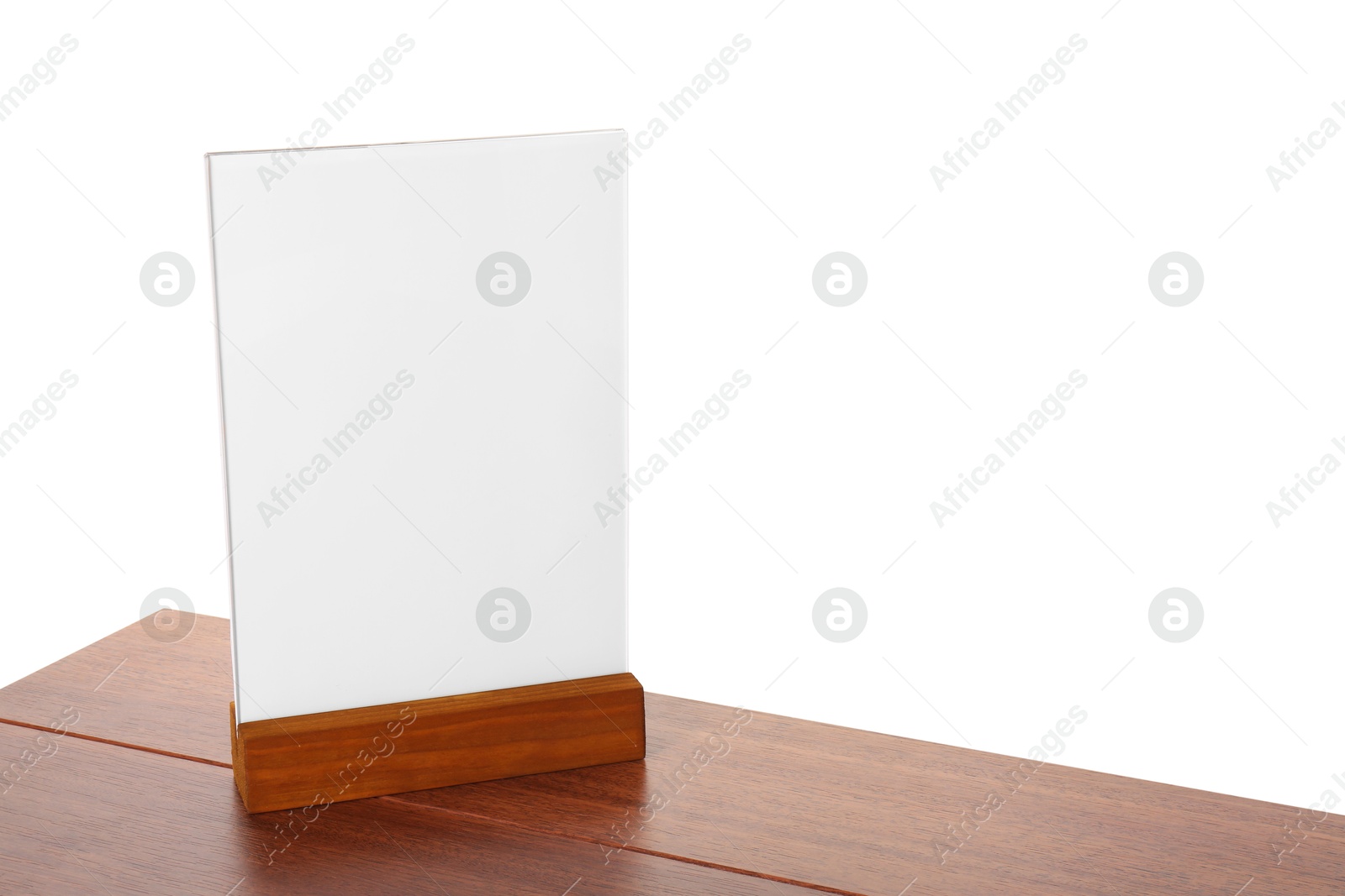 Photo of Menu holder on wooden table against white background. Mockup for design