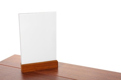 Photo of Menu holder on wooden table against white background. Mockup for design