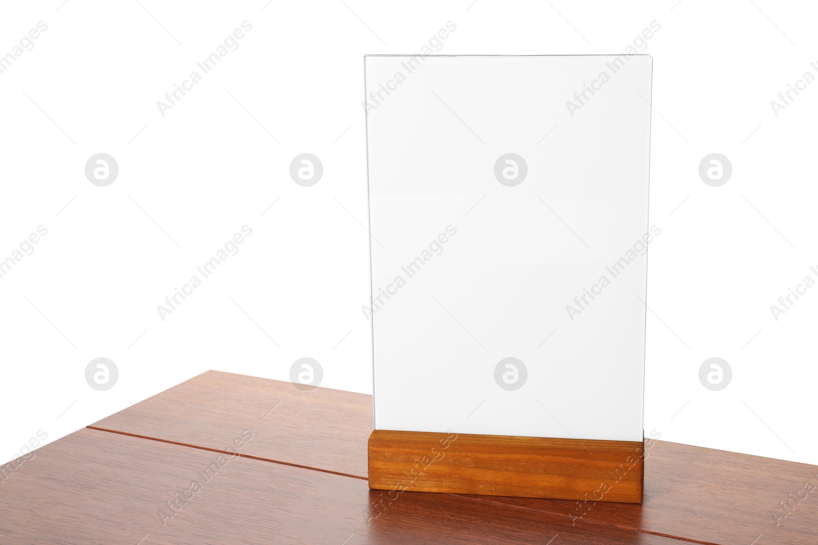 Photo of Menu holder on wooden table against white background. Mockup for design