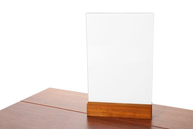 Photo of Menu holder on wooden table against white background. Mockup for design