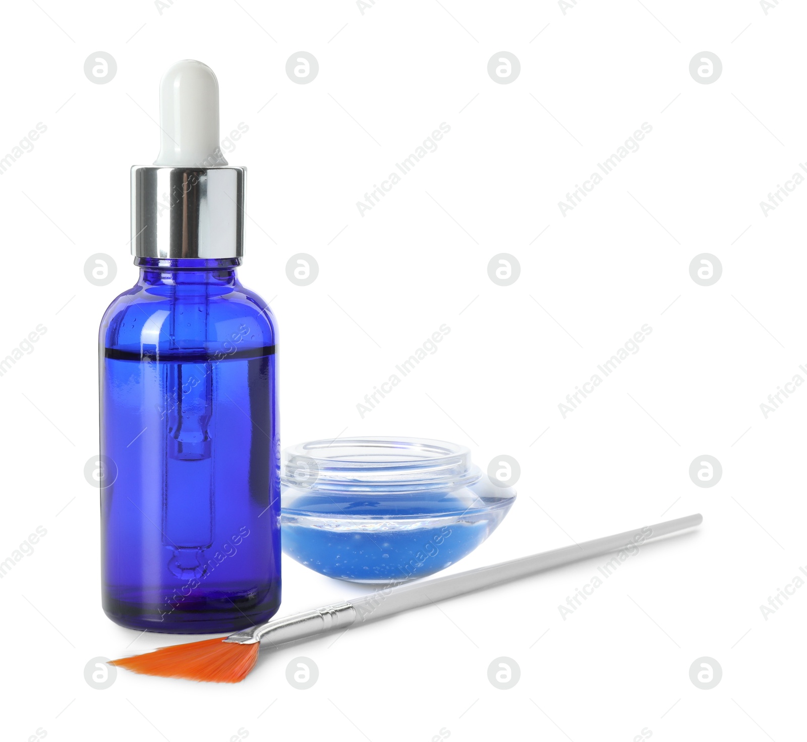 Photo of Bottle of chemical peel, bowl with liquid and brush isolated on white. Peeling procedure