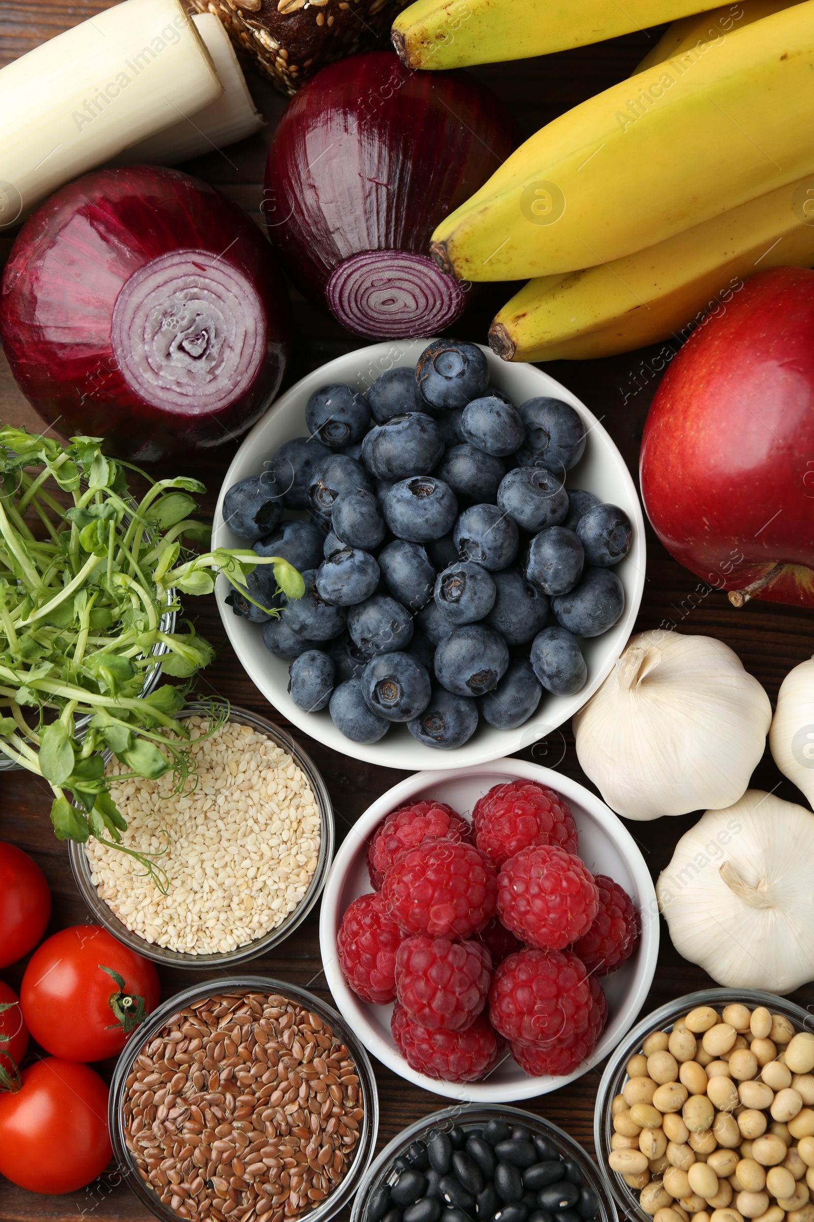 Photo of Different fresh products on table, flat lay. Source of prebiotics