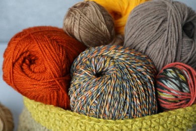 Soft woolen yarns in knitted bag, closeup